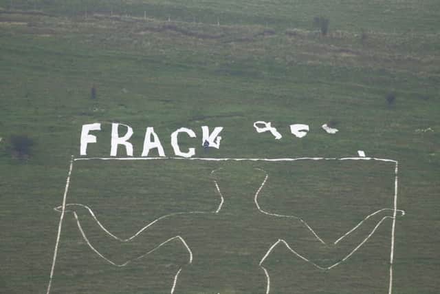 LONG MAN OF WILMINGTON 'FRACK OFF" TEAM THAT PLACED IT UP THERE - ANGRY FARMERS REMOVED IT - CONTACT GROUP ON 07754750051 - BECKY SUS-151016-114151001