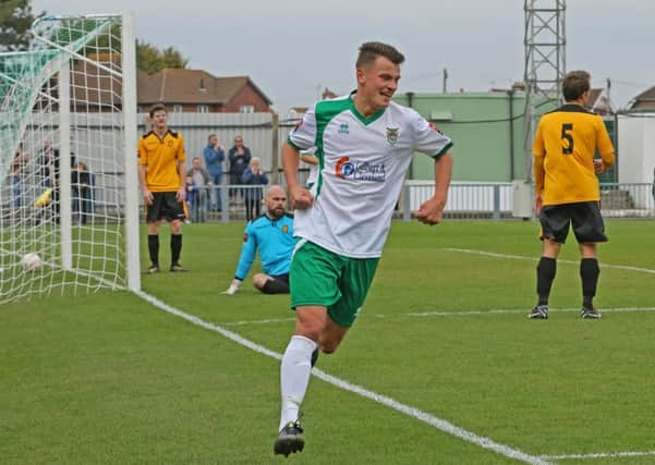 Alfie Rutherford turns to celebrate his first goal / Picture by Tim Hale