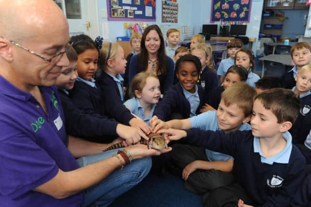 Dale Preece-Kelly showing the pupils at St Mary's  Catholic School some of his unusual selection of animals ks1500522-2