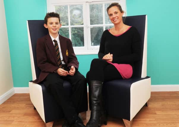 Melissa Toleman with her son Louis at her alternative therapy centre in Oathall Road, Haywards Heath (Pic by Jon Rigby) SUS-150311-112908008