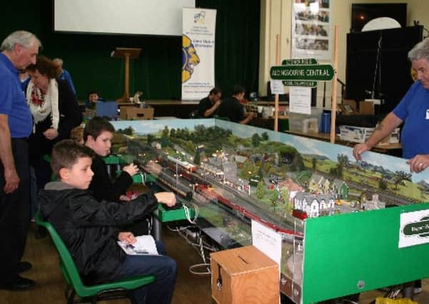 A busy scene at Aldingbourne Central, where young members of the public drive the trains provided by Bognor Regis Model Railway Club