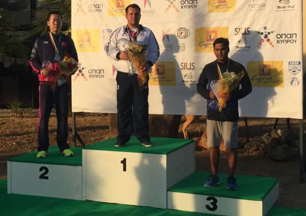 Steve Scott stands proudly on top of the podium at the ISSF World Cup Final in Cyprus