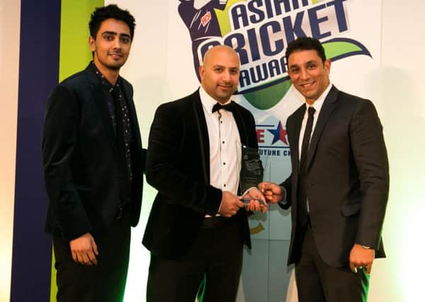 Azam Riyard, middle, is presented with is Grassroots cricket award by Kent criicketer AzharMahmood and BBC Asian Network presenter Yasser SUS-151020-111129002
