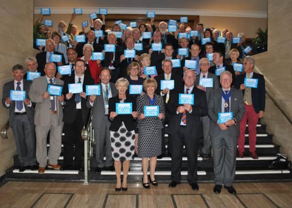 West Sussex county councillors pictured in County Hall, Chichester, pledging to stand up against Child Sexual Exploitation (photo submitted). SUS-151020-152147001