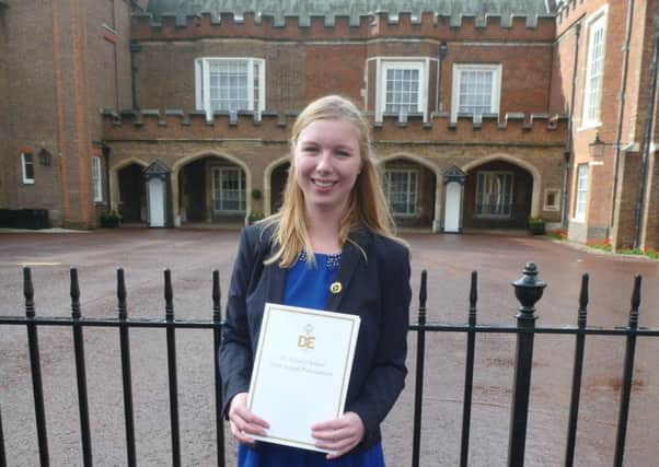 Verity Baker-Irons, 19, at St James Palace after receiving her gold Duke of Edinburgh's Award from Prince Edward