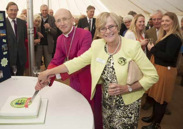 Celebrating 125 years with a birthday cake cutting by the Bishop of Chichester and Alyson Heath from Chichester Diocesan Association for Family Support Work