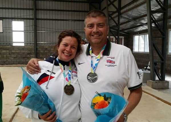 Liz and Russ with their medals in Argentina