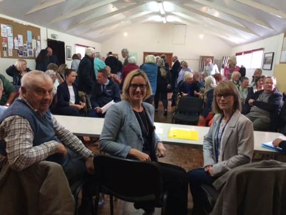 Peter Turner, chairman of Icklesham Parish Council and Branwen Rhead, from Southern Water with Amber Rudd