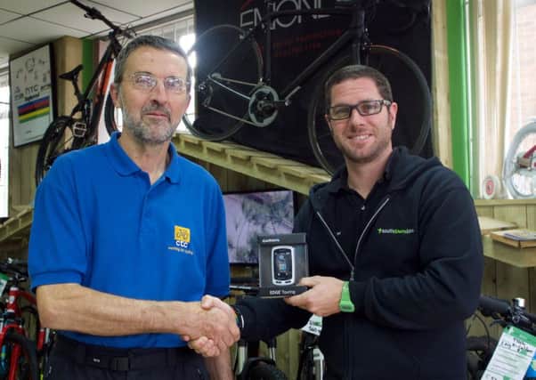 Mike Croker Bramber won a Garmin Edge Touring GPS and Alex Taylor, the manager of South Downs Bikes in Goring (photo submitted). SUS-151022-103108001