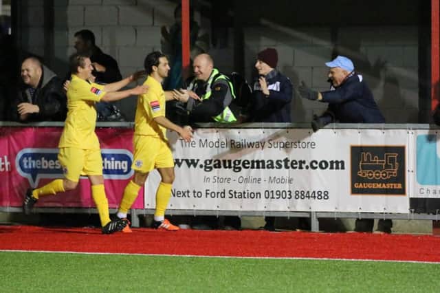 Hastings United celebrate their second goal in Tuesday night's 3-1 win away to Worthing. Picture courtesy Joe Knight