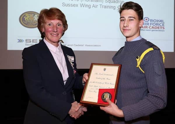 Andrew Stuckey accepts his award from the Lord Lieutenant of West Sussex Susan Pyper lPJGdj8zmlxEOZnSO1uM