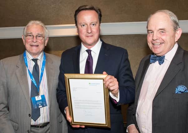 Arundel and South Downs Conservative Association recognised by Prime Minister  (L to R) Mr Bruce Henderson (Treasurer) David Cameron, and Cllr Peter Griffiths (Chairman) SUS-151027-092406001