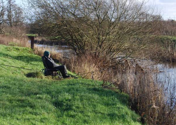 An angler on the Rother