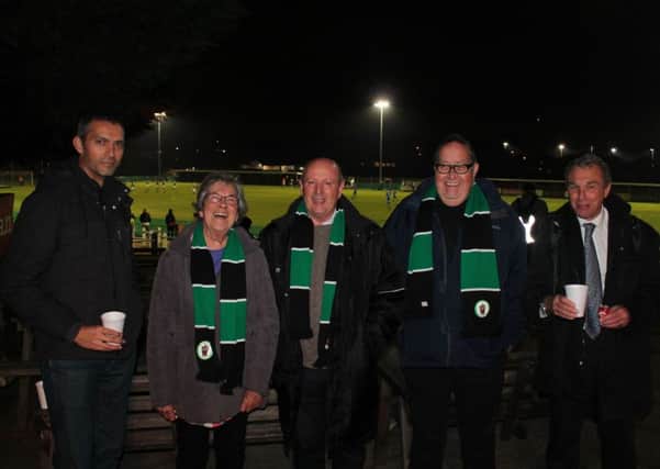 Chairman Kevin Newell (centre) shares a joke with Hill fans at VCD Athletic.