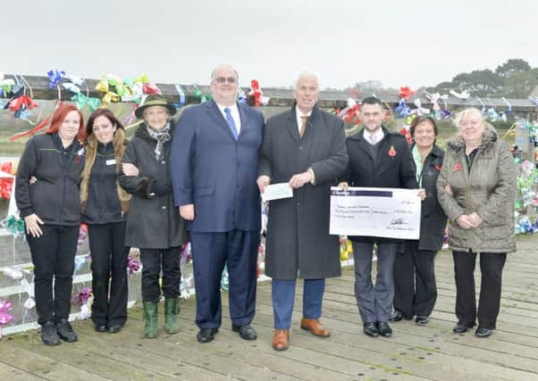 More than £10,000 was presented to the Sussex Community Foundation's Shoreham Air Disaster Fund     Picture: Andrew Mardell