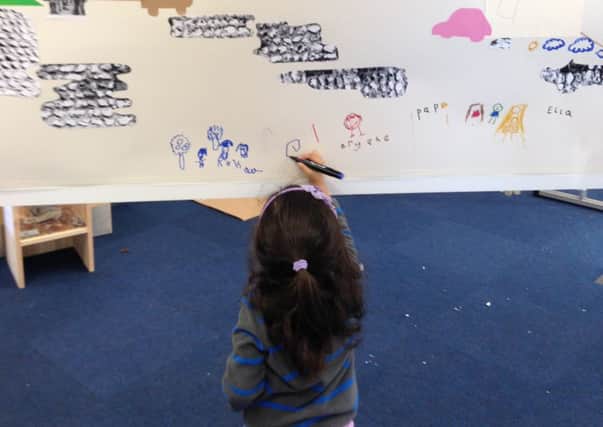 One of the children takes part in the Big Draw event at Arundel Museum