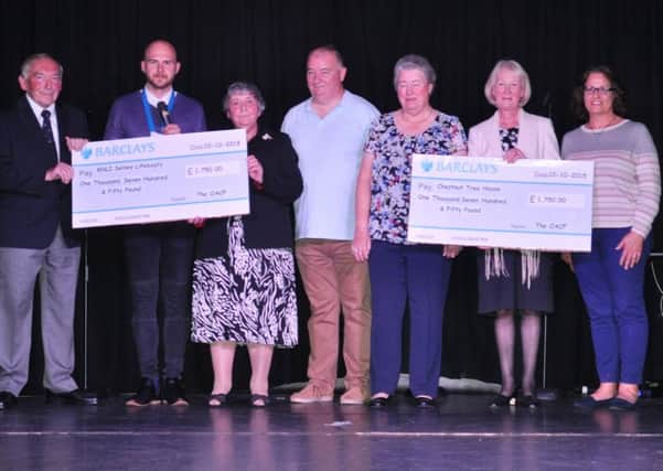 RNLI Selsey Lifeboat and Chestnut Tree House receive cheques from the Owners Association of Church Farm