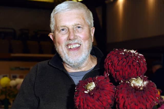 Bruce Button with his prize-winning chrysanthemums LP1502341