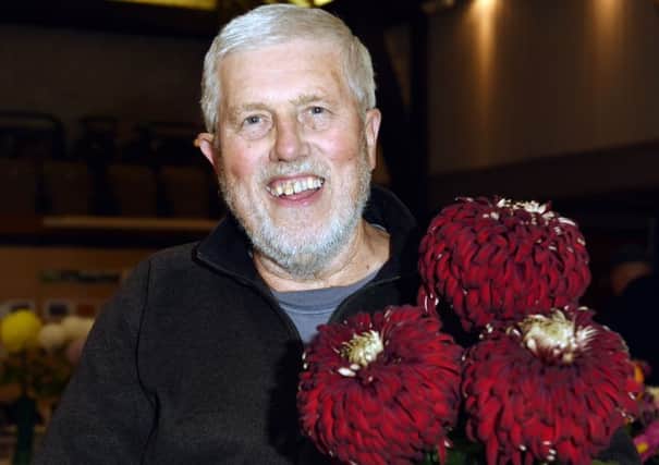 Bruce Button with his prize-winning chrysanthemums LP1502341