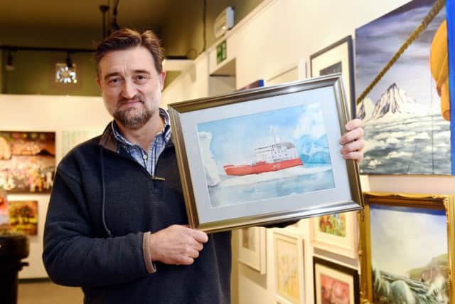Jonathan Webb with his painting HMS Endurance on Patrol In Antarctica 

Lp1502253