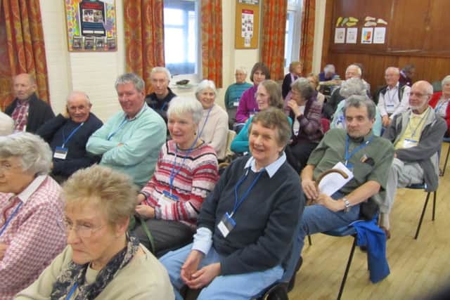 Members of the Worthing and District Branch of Parkinson's UK listening to a speaker at one of the monthly branch meetings