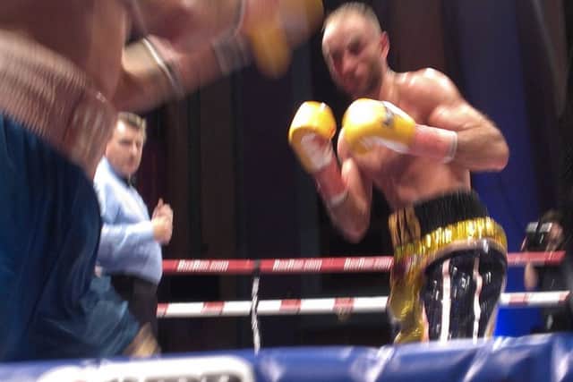 Ben Jones in action against Martin Parlagi fighting for the WBO Inter-Continental featherweight title. Picture by Graham Carter SUS-151031-101758002