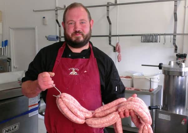 Liam O'Hagan sets a new Guiness World Record for the most sausages produced in one minute