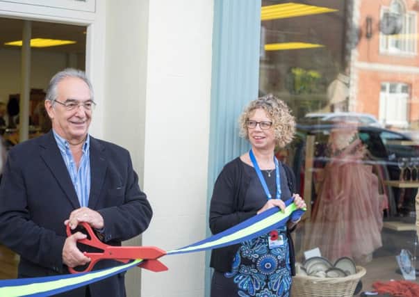 Peter Stoakley cutting the ribbon with chief executive Alison Moorey