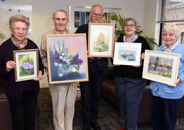 Horsham Painting group with some of their recent work. L-R Daphne Davies with Clematis, John Weeks with Floral Delights, David Jeans with Nymans West Sussex, Sue Mitchell with Maltese Boats and Elizabeth Rowell with Bursting into Life.

Picture: Liz Pearce 041115
LP1502536 PPP-151011-092900006