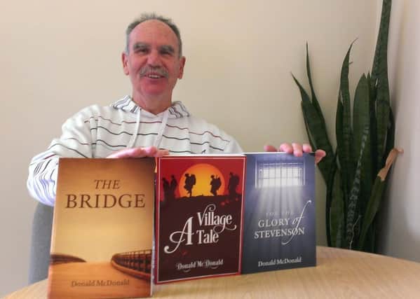 Donald McDonald with his books, The Bridge, A Village Tale and For the Glory of Stevenson