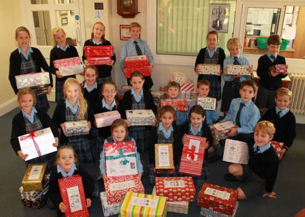 Cranleigh Prep School pupils with their festive charity shoeboxes SUS-151123-151514001