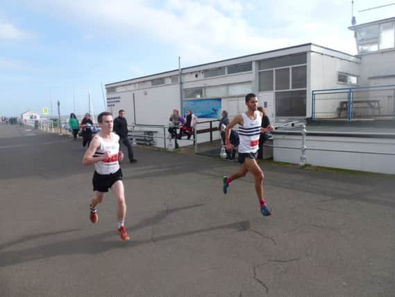 A couple of the leading runners in the 2014 Poppy Half Marathon (SUS-141011-205355002)