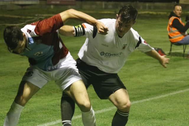 Action from Hastings United's 4-1 defeat at home to Faversham Town on Tuesday night. Picture courtesy Joe Knight
