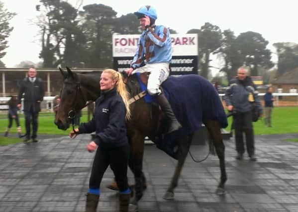 Joshua Moore comes into the winner's enclosure on Flute Bowl
