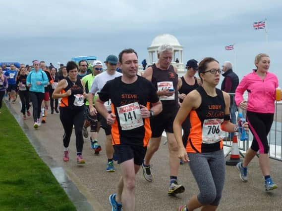 Runners head off in the Poppy Half Marathon in Bexhill. Picture by Simon Newstead (SUS-150811-103555002)