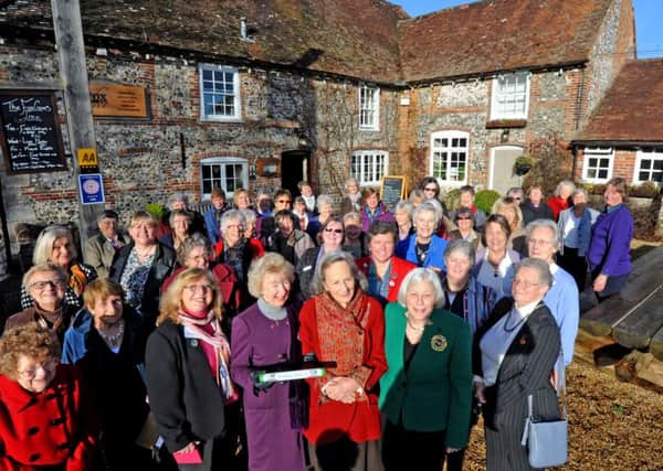 Members of the WI  outside the Fox Goes Free in Charlton, to pass the baton to the Hampshire WI branch earlier this year. From front centre left to right: June Moran, chairman of the West Sussex WI Federation, the Duchess of Richmond, and Brenda Fletcher, chairman of the Hampshire Federation PICTURE BY KATE SHEMILT C141545-2