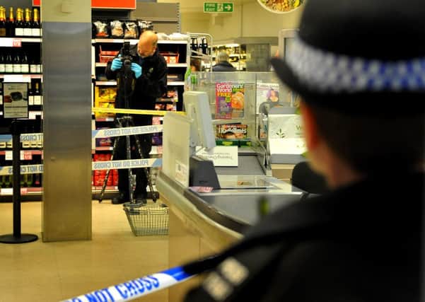 Police gather evidence after a serious incident in the Waitrose store at Storrington. 29-04-15, Pic Steve Robards SUS-150429-202612001