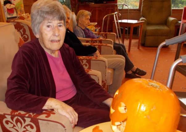 Helen Tyson with her carved pumpkin SUS-151111-102650001