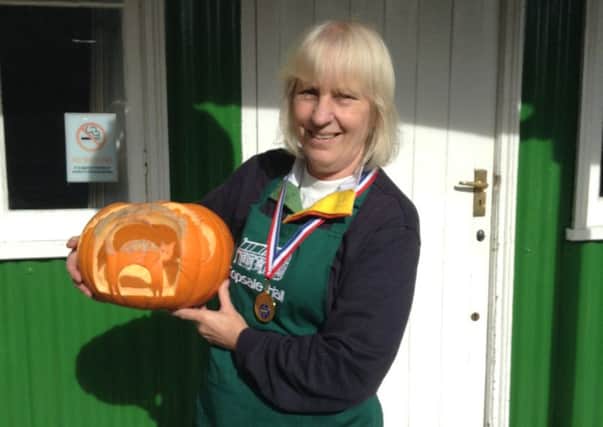 Dilly Cooper with her winning carved pumpkin SUS-151111-105612001