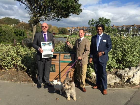 Rother District Council is backing the â¬ÜWeâ¬"re Watching Youâ¬" campaign. Pictured (from left) at Egerton Park, in Bexhill, are: Malcolm Johnston (RDC executive director of resources), Cllr Ian Hollidge (RDC cabinet member for environment, transport and public realm), Cllr Abul Azad (RDC member for Bexhill Central) â¬ with canine pals Lola and Hector SUS-151111-121235001