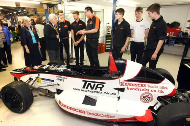 DM15225184a Worthing mayor and mayoress Michael Donin and Linda Williams with the motor sport team from Northbrook College