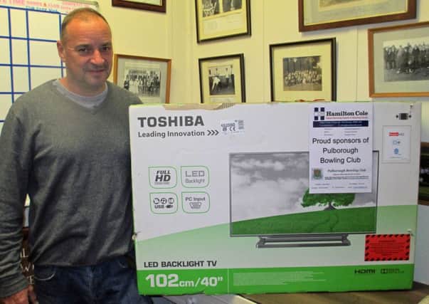 Fred Bushby with his prize from the Pulborough Bowls Club draw SUS-151111-131000001