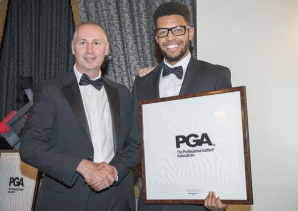 Colton Alleyne-Davis receives his PGA South Assistant of the Year award from the chairman of The PGA in England (South), John Kennedy. Picture courtesy Corporate Events Photography