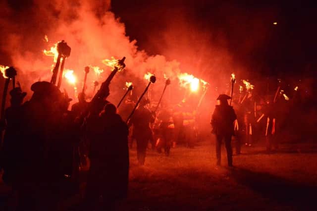 Rye Bonfire Society torchlight procession through Rye, bonfire and fireworks. Saturday November 8th 2014. SUS-151109-125341001