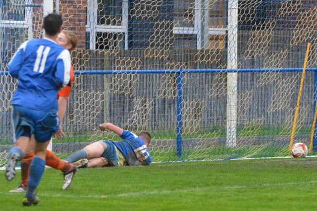 Rob O'Toole slides in for the third. Picture by Grahame Lehkyj