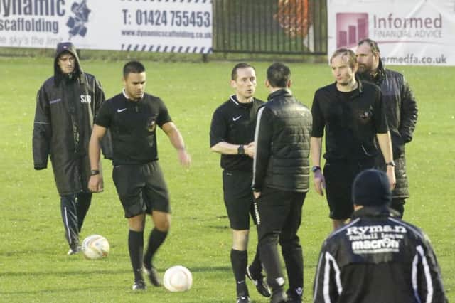 The officials inform the Merthyr Town management of their decision to abandon yesterday's game at half time. Picture courtesy Joe Knight