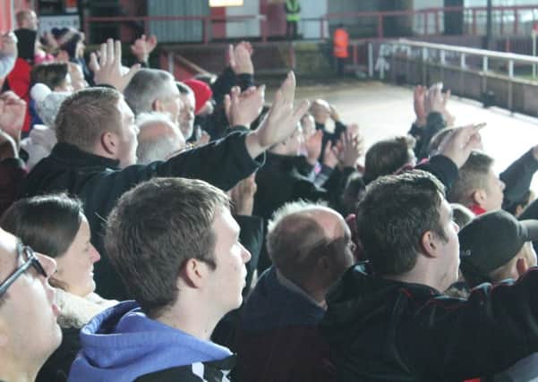 Crawley Town fans celebrate earning a 2-2 draw at Exeter City SUS-151116-101644002