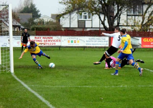 Julian Boniface puts Pagham into the lead / Picture by Roger Smith