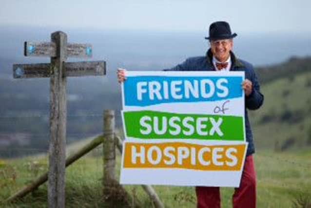 TIM WONNACOTT STANDS AT DITCHLING BEACON TO LAUNCH FRIENDS OF EAST SUSSEX HOSPICES RENAMING TO FRIENDS OF SUSSEX HOSPICES.