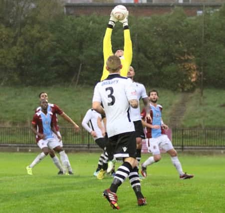 Merthyr Town goalkeeper Tom Bradley gathers a cross against Hastings United on Saturday. Picture courtesy Scott White